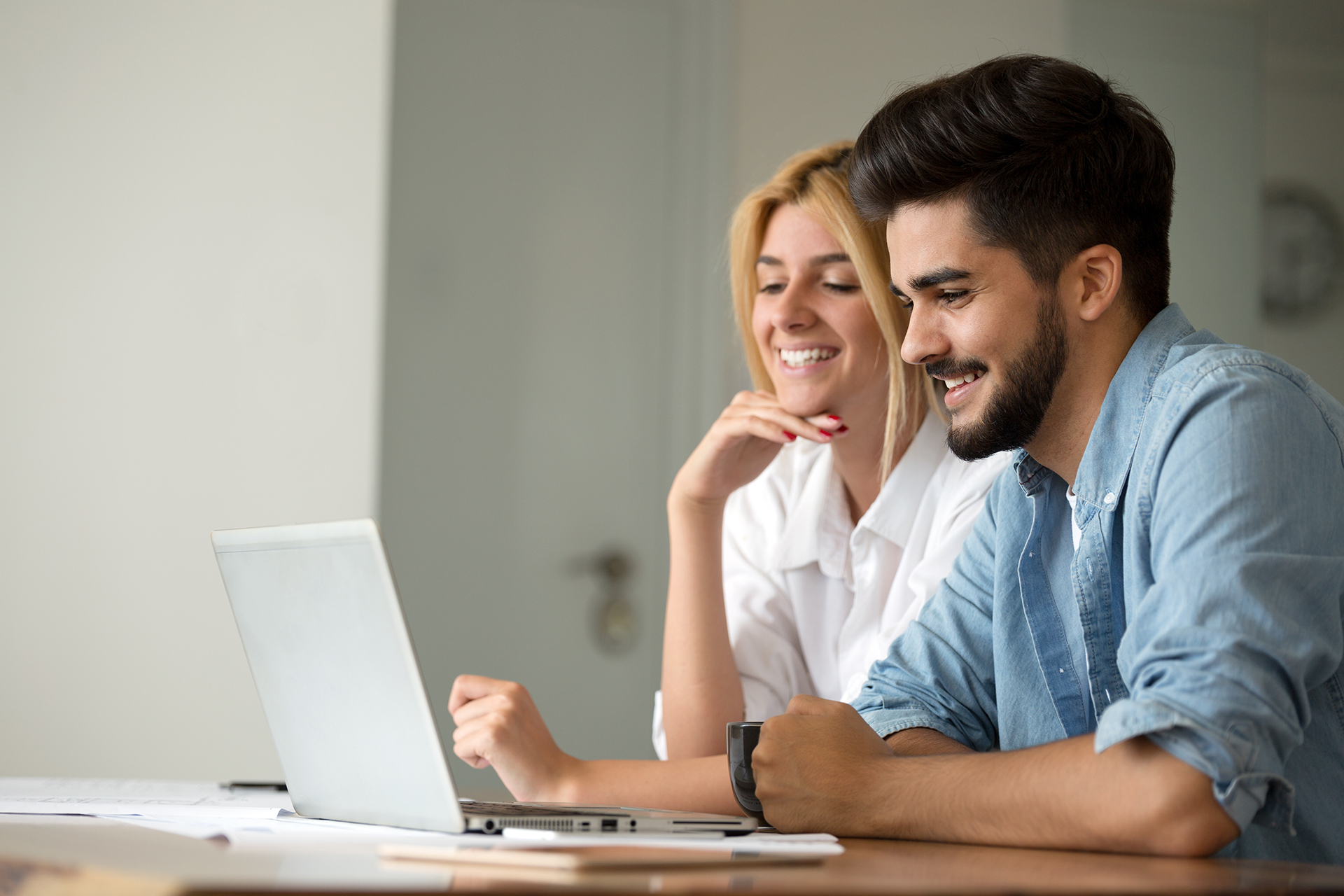 young couple on a computer