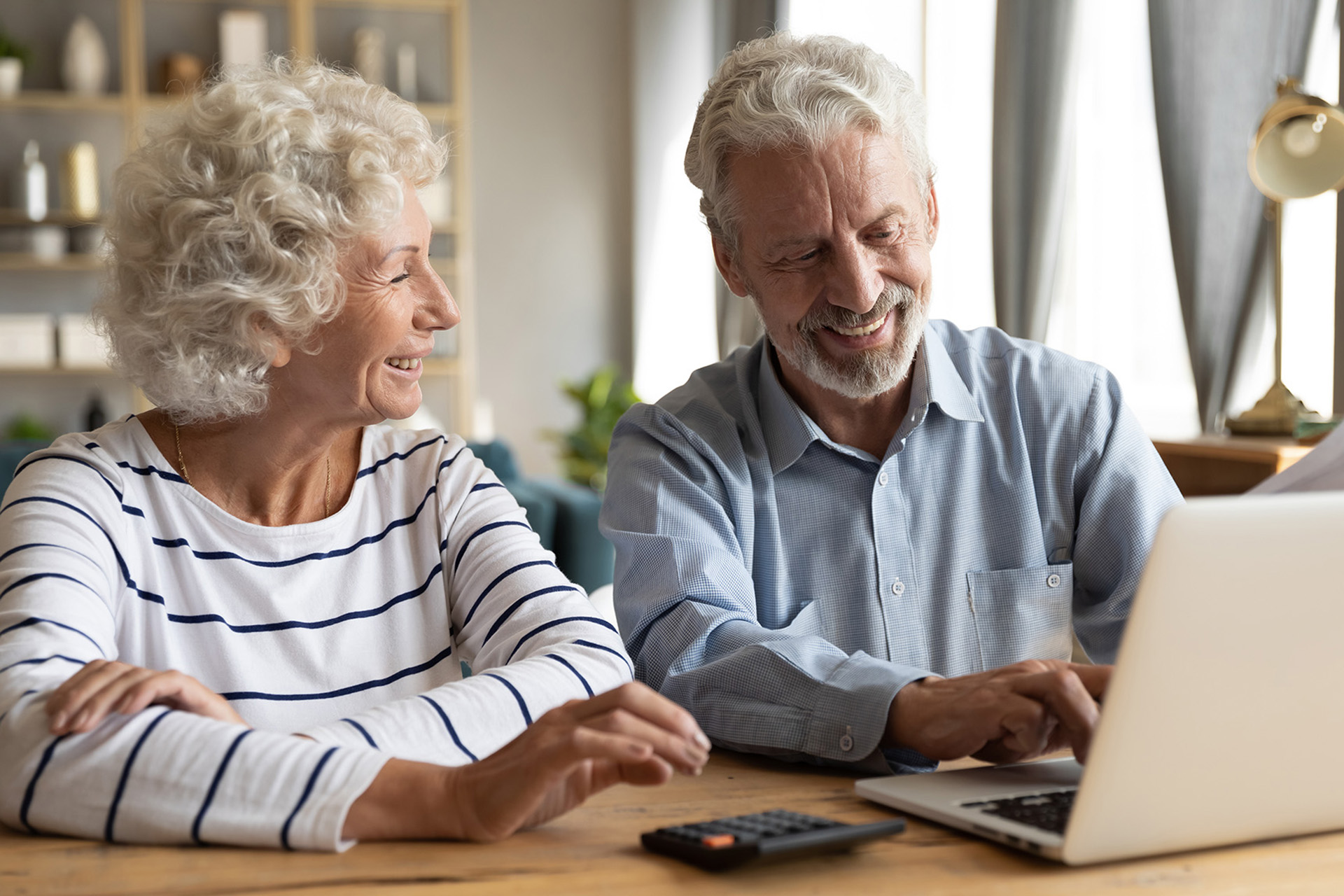 retired couple on a computer