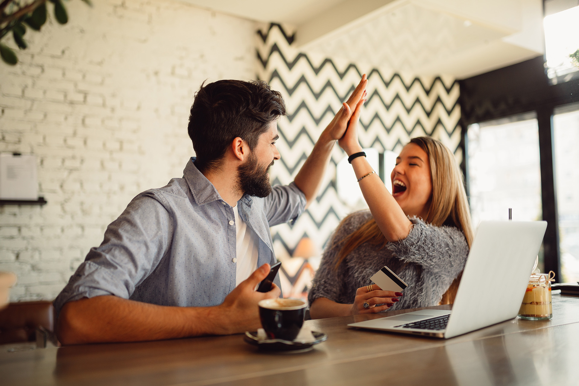 man and woman high-fiving