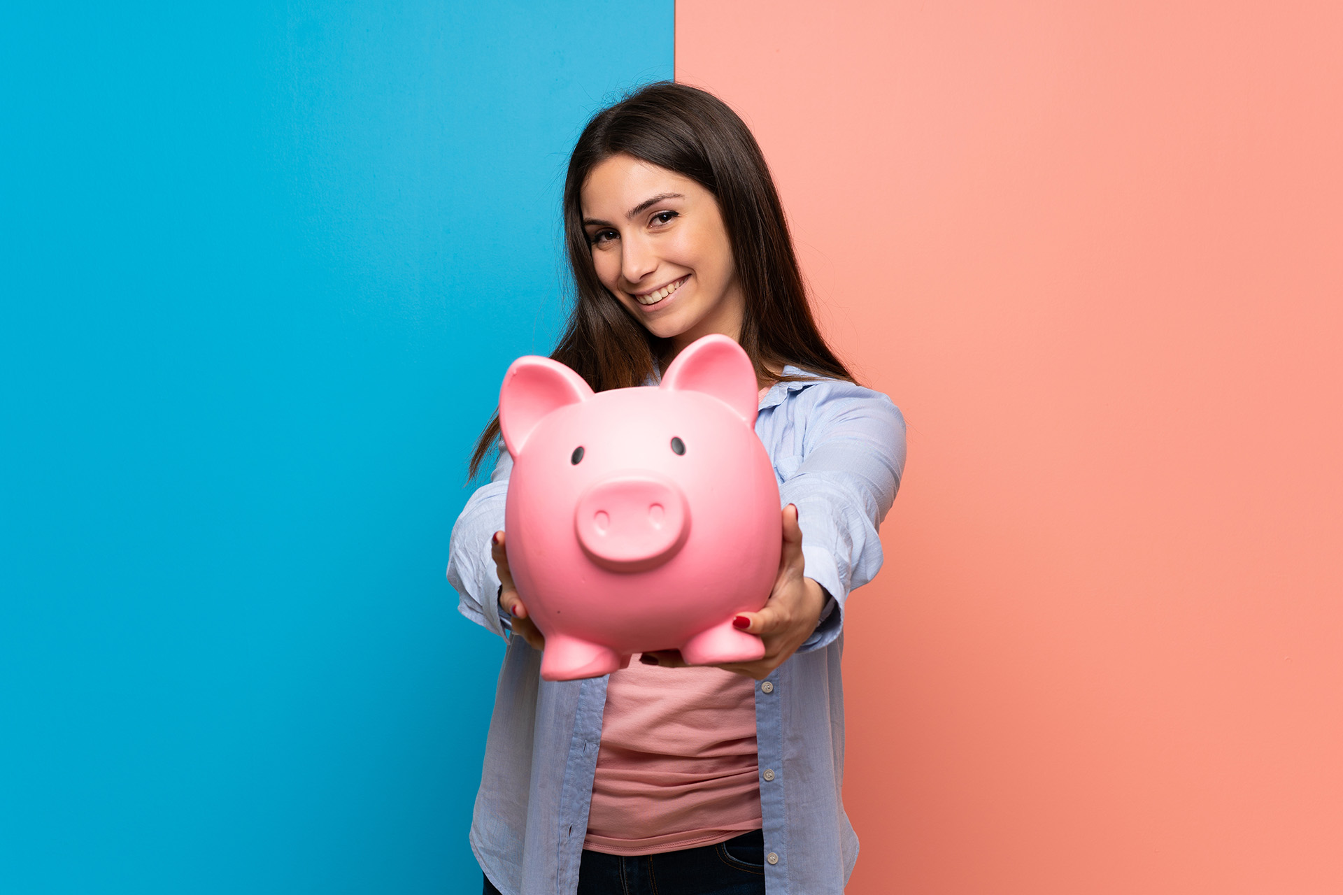 woman holding piggy bank
